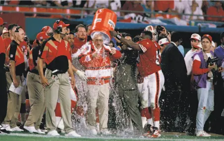  ?? Lynne Sladky / Associated Press 1995 ?? 49ers head coach George Seifert is doused with ice water late in the fourth quarter of his team's 4926 win over the Chargers.