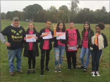  ?? CHAD FELTON — THE NEWS-HERALD ?? Team Pumpkin Chunkin Willoughby Warriors won two awards on Oct. 27 during the Third Annual Pumpkin Chunkin event at Osborne Park. From left is Coach Daniel Triana, Sophia Winslow, Jeremy Walton, Trinity Hawley, Justin White, Taylor Bright and Maitea McKenzie. The Willoughby Middle School team set a new event record with a launch of over 317 feet.