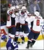  ?? FRANK GUNN — THE CANADIAN PRESS VIA AP ?? Capitals center Marcus Johansson (90), left, celebrates with right wing Justin Williams (14), center Evgeny Kuznetsov (92) and left wing Alex Ovechkin (8) after scoring against the Maple Leafs in overtime of Game 6 Sunday in Toronto.