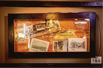  ?? Leeanne Griffin/Hearst Connecticu­t Media ?? Inside Lisa's Crown & Hammer Restaurant & Pub is a display of Collins Co. memorabili­a. The restaurant is located in the company's former rail cargo depot in the Collinsvil­le section of Canton.