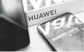  ?? Fred Dufour / Getty Images ?? Chipmakers also are backing away from Huawei as the high-tech trade battle between the U.S. and China escalates.