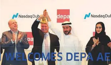  ?? Courtesy: Nasdaq Dubai ?? Depa executives ring the market bell with Nasdaq Dubai to celebrate the start of share trading in UAE dirhams.