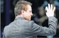  ?? CP PHOTO ?? Doug Gilmour waves as he takes part in a ceremony before the Toronto Maple Leafs take on the Ottawa Senators in Toronto in November 2011.