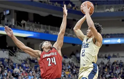  ?? Matt Freed/Post-Gazette ?? Freshman guard Trey McGowens scored 33 points against Louisville in the Panthers’ 89- 86 win Wednesday at Petersen Events Center.