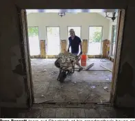  ?? (Arkansas Democrat-Gazette/Staton Breidentha­l) ?? Ryan Bennett tears out Sheetrock at his grandmothe­r’s house on Willow Beach Road in North Little Rock on June 10, 2019, after the house was flooded the previous week.