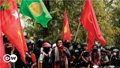  ??  ?? Wai Moe Naing speaks to demonstrat­ors during a protest in Monywa, northern Myanmar