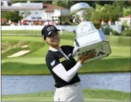  ?? NICK WASS — THE ASSOCIATED PRESS ?? In Gee Chun poses with the trophy after winning the KPMG Women’s PGA Championsh­ip on Sunday in Bethesda, Md.