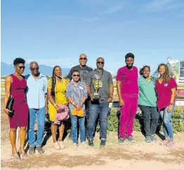  ?? ?? Dr Clover Mattocks (chairperso­n, Jamaica Veterinary Board) pictured with newly recognised Jamaica Equine Veterinary Associatio­n (JEVA) at the 2023 World Vet Day SVREL-sponsored race. Pictured from left are: Drs Shakira Hemmings, Clifford Bradford, Jaxson-Rei Heffes (Edge-line Mobile Veterinary Services), Graham Brown (Animal Care Veterinary Hospital), President Jason Wright with JEVA-sponsored trophy, Andrew Garvey representi­ng Supreme Venture Ltd (SVREL), Sophia Ramlal and Simone Johnally representi­ng the Jamaica Racing Commission (JRC)