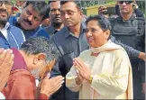  ?? HT PHOTO ?? SP leader Ram Govind Chaudhary and BSP chief Mayawati greet ▪
each other in Lucknow on Wednesday.