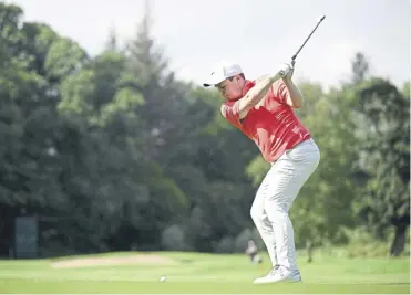  ?? ?? Bob Macintyre plays his second shot on the 10th hole on his way to an opening 69 at Galgorm Castle