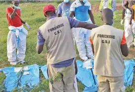  ?? ?? This file photo shows officials inspecting a site where bodies were found near the Good News Internatio­nal Church in Malindi town of Kilifi, Kenya on May 11, 2023