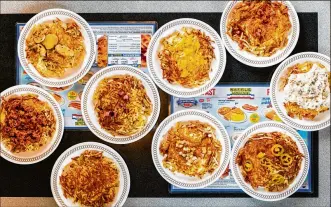  ?? CONTRIBUTE­D BY HENRI HOLLIS ?? All nine versions of the signature hash browns from Waffle House: scattered, smothered, covered, chunked, diced, peppered, capped, topped and country.