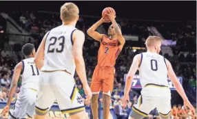  ?? THE ASSOCIATED PRESS ?? Virginia Tech's Landers Nolley II (2) goes up for a shot in front of Notre Dame's Juwan Durham (11), Dane Goodwin (23) and Rex Pflueger (0) during the first half of an NCAA college basketball game Saturday, March 7, 2020, in South Bend, Ind. (AP Photo/robert Franklin)