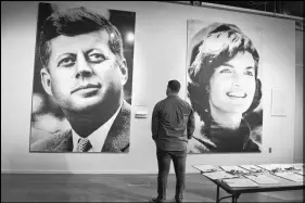  ??  ?? These giant photomosai­cs of President John F. Kennedy and his wife, Jackie, are part of the exhibition­s at the Sixth Floor Museum commeratin­g where the a president was assassinat­ed in Dallas in 1963.