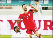  ??  ?? Oman player is fouled during the Group B soccer match against Bahrain.