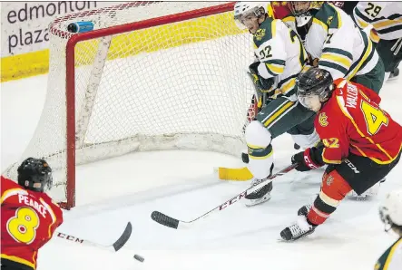  ?? IAN KUCERAK ?? University of Calgary Dinos forward Elgin Pearce scores one of his Canada West-leading 20 goals earlier this season against the Alberta Golden Bears. Pearce credits coach Mark Howell and his staff for turning the team’s fortunes around in the second...