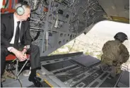  ?? Jonathan Ernst / Getty Images ?? U.S. Defense Secretary Jim Mattis looks out over Kabul as he arrives for briefings via helicopter.