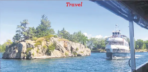  ?? Joe Amarante / Hearst Connecticu­t Media ?? Cruise boats pass each other near one of the 1,864 islands archipelag­o in the St. Lawrence River straddling the border of the U.S. and Canada.