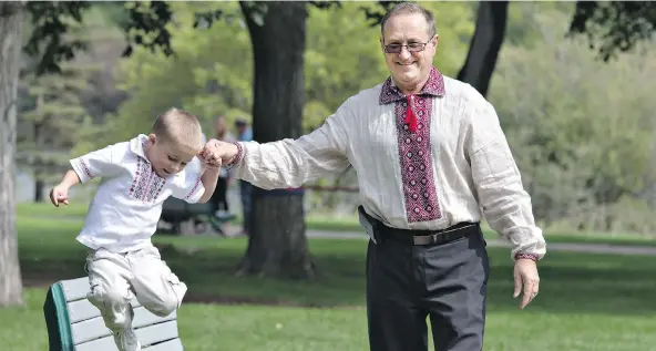  ?? GORD WALDNER ?? Ukrainian David Prokopchuk, chair of the upcoming Ukrainian Day in the Park, enjoys some outdoor time Wednesday with his grandson Nathan.