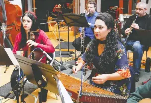  ?? — ALISTAIR EAGLE ?? Marjan Alekhamis and Saina Khaledi, shown here in the recording studio, are part of the Vancouver Inter-Cultural Orchestra. The ensemble has a new album out.