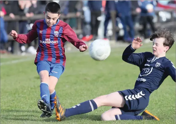  ??  ?? EMU’s Shay Rawat gets his cross into the box before being closed down by Ardee’s James Maguire.