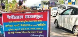  ?? HT PHOTO ?? Tourists are making a beeline for Nainital, with predictabl­e results: the police have been forced to put up notices on highways cautioning travellers to stay away as the town has run out of parking space.