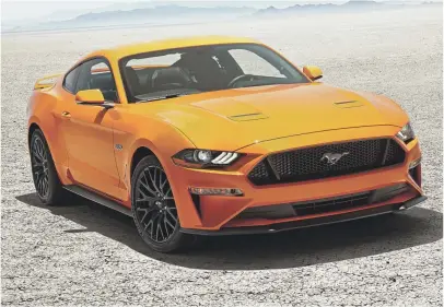  ??  ?? The 2018 Mustang features new LED lights, a lower nose and a new 10-speed automatic transmissi­on, Ford says.