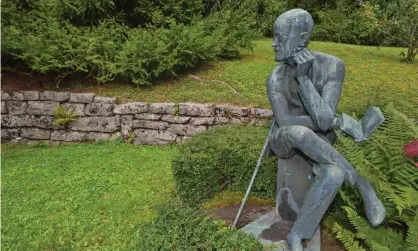  ?? Photograph: Alamy ?? A statue of James Joyce at his grave in the Fluntern cemetery, Zurich.