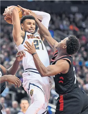  ?? NATHAN DENETTE THE CANADIAN PRESS ?? Kyle Lowry and the Raptors put pressure on Jamal Murray’s Nuggets in the second half after a cold start at Scotiabank Arena. Murray, from Kitchener, finished with 21 points.