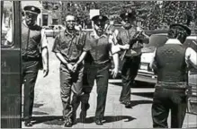  ?? PHOTO PROVIDED ?? Officers lead prison inmate Willie Bosket, Jr., second from left, who has been incarcerat­ed for all but 100 days of his adult life.