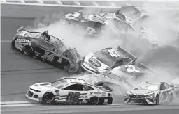  ??  ?? Clint Bowyer (14), Alex Bowman (88), Kyle Busch (18), Kyle Larson (42), Ryan Preece (47), Martin Truex Jr. (19), Chase Elliott (9), Austin Dillon (3) and Ryan Blaney (12) get caught up in a multi-car crash during Sunday’s NASCAR race at Daytona Internatio­nal Speedway.