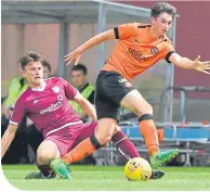  ??  ?? Dundee United’s Declan Glass goes past Arbroath’s Bobby Linn.