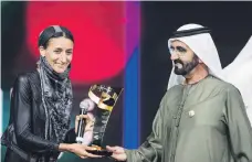  ?? Reem Mohammed / The National ?? Sheikh Mohammed bin Rashid with Nawal Al Sufi at the awards ceremony last year