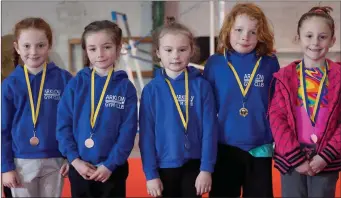  ??  ?? Under nine girls winners Caitlin Holt (first), Lily-Jo Rowlands (second), Sophie Hurley and Emily Christophe­r (joint-third) and the under nine boys winner Lincoln Breen.