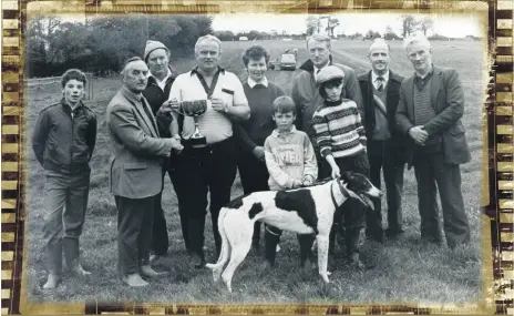  ?? ?? Denis O’Leary (2nd left), chairman of Fermoy Coursing Club, presenting the winning trophy to Michael Walsh, Kildorrery, owner of ‘I’m No Model’, winner of the Fermoy Inter Club Stakes at Fermoy coursing in October 1989. Also included are Jim Barrett, Joe Curry, Mary Walsh, Michael Walsh Jnr., Eileen Walsh, Jerry Desmond (chief executive, Irish Coursing Club), John O’Regan and Eddie Dwane.