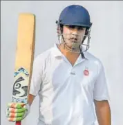  ?? AP ?? Gambhir raises his bat after completing his fifty on Friday.