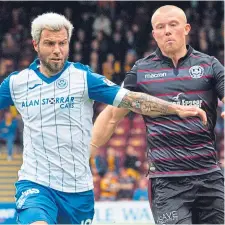  ??  ?? St Johnstone man Richard Foster (left).