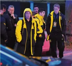  ??  ?? Ugly memory: Shinji Kagawa (centre) and other Borussia Dortmund players being escorted by the police to safety after a bomb blast in their team bus on April 11. — AFP