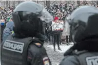  ?? PAVEL GOLOVKIN THE ASSOCIATED PRESS ?? A woman holds a banner during a protest against the jailing of opposition leader Alexei Navalny in Moscow, Russia.