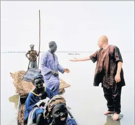  ??  ?? HOMEBOY: This image of Salif Keita with Malians on a fishing boat indicates that he has rejected the caste system of his society and extended a hand of friendship to everyone.