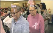  ?? STAFF PHOTOS BY JOHNATHON CLINKSCALE­S ?? Above left, Keynote speaker Marilyn Hughes-Gaston, center, takes a moment to greet an Alpha Kappa Alpha Nu Zeta Omega Chapter member during a survivors’ celebratio­n walk indoors. Above right, Charles County Board of Education member Margaret Marshall, who is a Nu Zeta Omega Chapter member, smiles as she participat­es in a survivors’ celebratio­n walk during Monday’s inaugural breast breast cancer awareness community impact day.