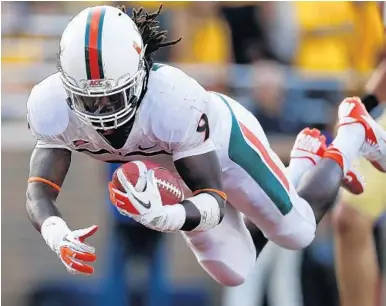  ?? JARED WICKERHAM/GETTY IMAGES ?? Malcolm Lewis scored a touchdown on this play in 2012 for the Miami Hurricanes before suffering a severe ankle injury later in the season that had a recovery time of a year and a half. He is joining the Dolphins as an undrafted free agent this weekend.