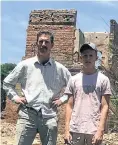  ??  ?? Ben Freeth and his son Stephen at the ruins of their farm in Chegutu, from which they were evicted in 2009.