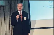  ?? Luther Turmelle / Hearst Connecticu­t Media ?? John Traynor, chief investment officer for Bridgeport-based People’s United Bank, delivers his economic outlook for 2022 on Thursday to members of the Greater New Haven Chamber of Commerce.