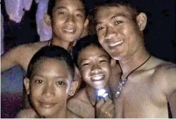  ??  ?? In good spirits: Some of the trapped Wild Boars football team during their ordeal