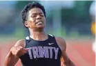  ??  ?? Trinity's Kevin Davis competes in the 200 meter dash during the 2018 TSSAA Track and Field State Championsh­ips in Murfreesbo­ro, Tenn.