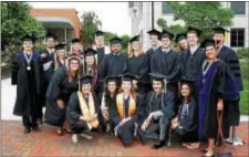  ?? KATHLEEN CAREY - DIGITAL FIRST MEDIA ?? Graduates of Widener University pose for a group photo at Saturday’s commenceme­nt exercises on the Chester campus.