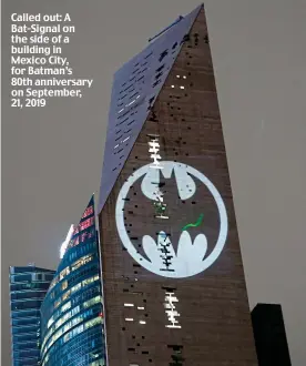  ?? ?? Called out: A Bat-Signal on the side of a building in Mexico City, for Batman’s 80th anniversar­y on September, 21, 2019