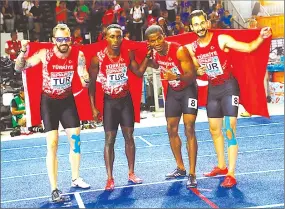  ??  ?? Yiğitcan Hekimoğlu (right) with team Turkey celebratin­g their silver medal win