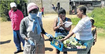  ?? Picture: Facebook Picture: Facebook ?? Residents of Orange Farm with some of the fresh produce they received.